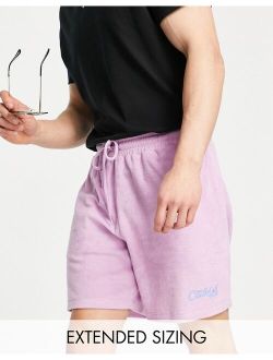 relaxed short in purple terrycloth with text embroidery
