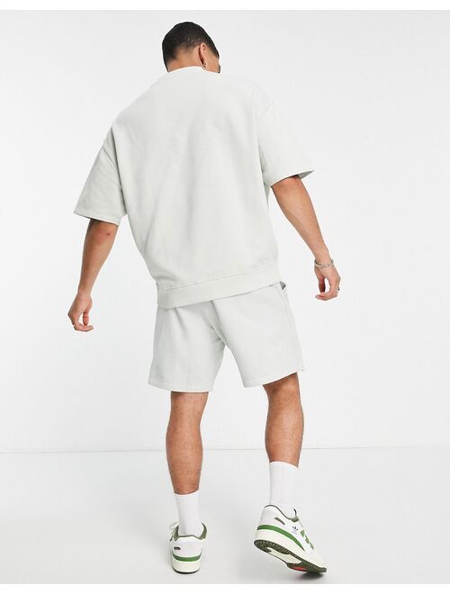 ASOS DESIGN oversized shorts in washed white cotton with city print - WHITE