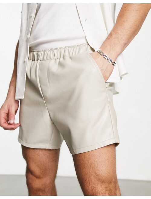 ASOS DESIGN slim fit leather look shorts in beige