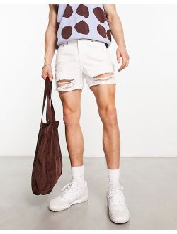 shorter length denim shorts with rips in white