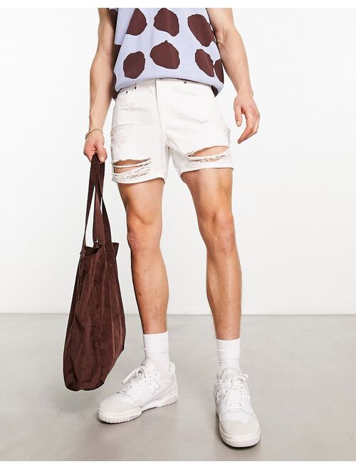 ASOS DESIGN shorter length denim shorts with rips in white