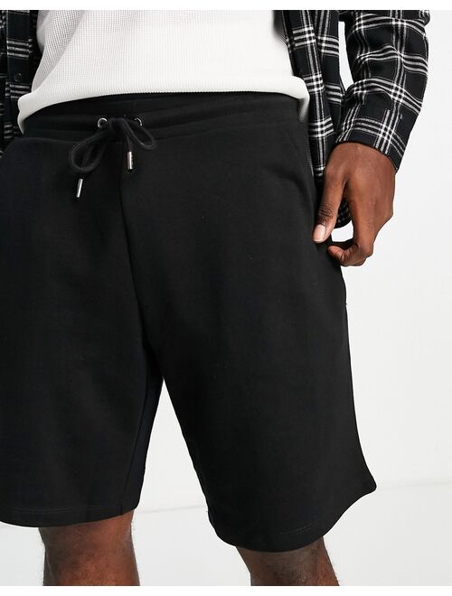 ASOS DESIGN oversized jersey shorts in black