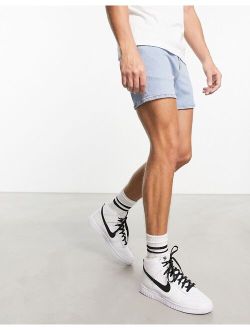 skinny denim shorts in light wash blue in shorter length