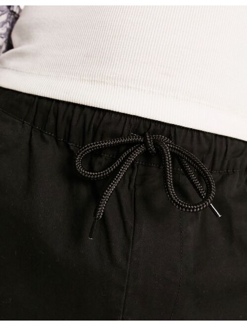 ASOS DESIGN skinny chino shorts in shorter length in black
