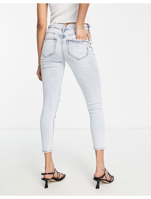 River Island Petite distressed knee mid rise skinny jeans in light blue