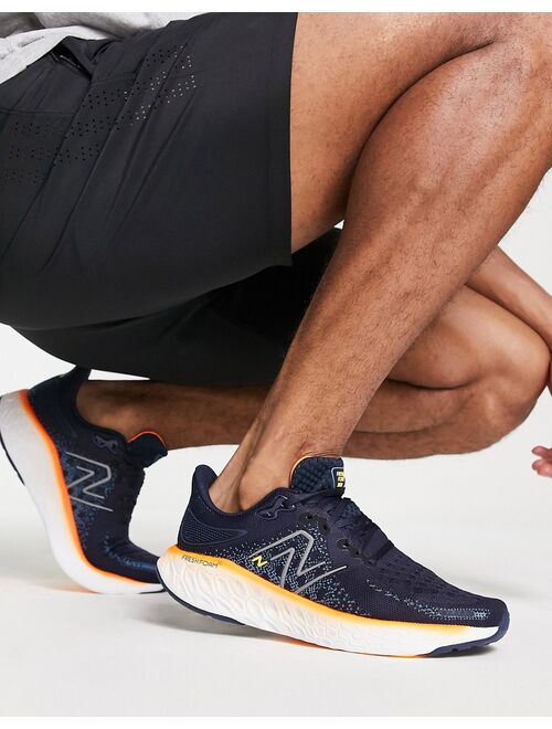 New Balance Running 1080 sneakers in navy and orange