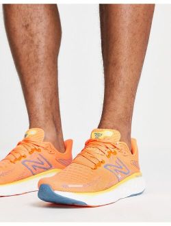 Running 1080 sneakers in orange