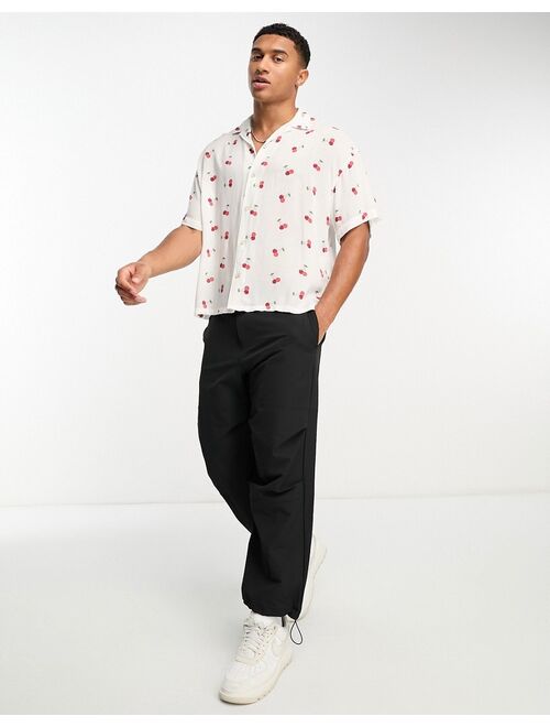 ADPT oversized revere collar short sleeve shirt in cherry print in white