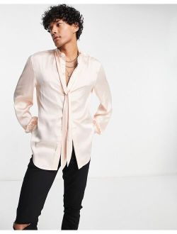 ASOS DESIGN satin shirt with blouson sleeve and tie neck in pink