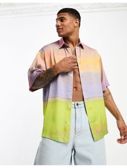 boxy oversized satin shirt in pastel scenic print