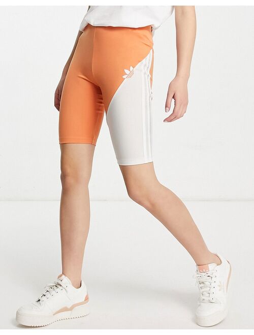 adidas Originals sliced trefoil legging shorts in white and hazy copper