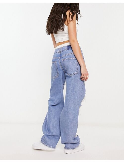 ASOS DESIGN baggy boyfriend jean with extreme rip in mid blue