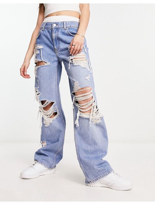 ASOS DESIGN baggy boyfriend jean with extreme rip in mid blue