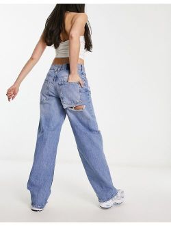 baggy boyfriend jean in mid blue with cheeky rips