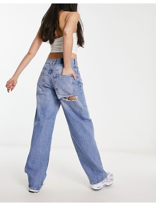 ASOS DESIGN baggy boyfriend jean in mid blue with cheeky rips