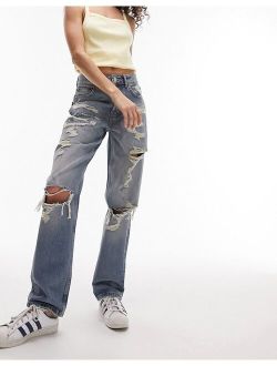 Dad jeans with extreme rip & repair in mid blue