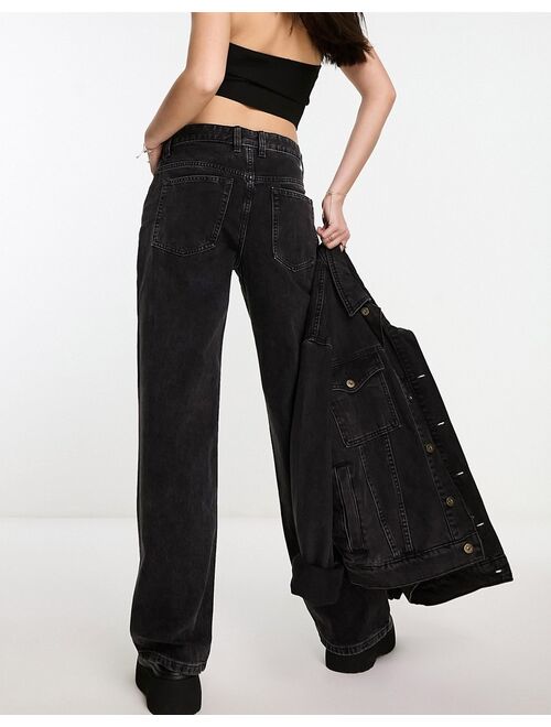 ASOS DESIGN baggy boyfriend jeans in washed black with knee rips