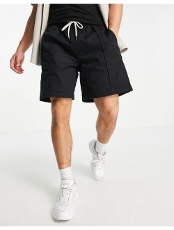 pleated chino shorts in black