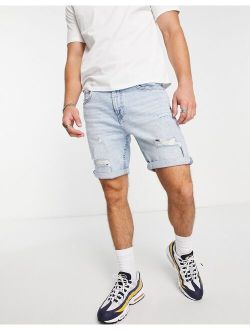 slim denim shorts with rips in light blue