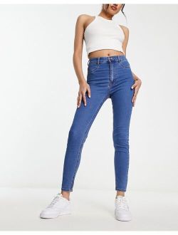 high waist skinny jeans in mid blue