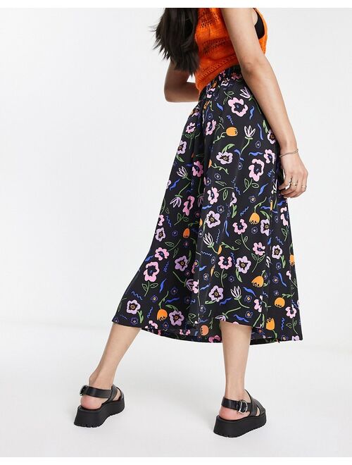 Monki button through midi skirt in black floral print