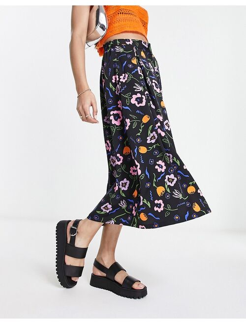 Monki button through midi skirt in black floral print