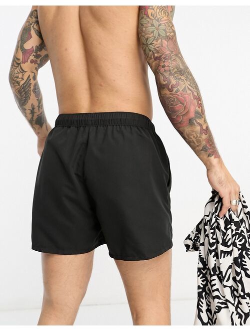 ASOS DESIGN swim shorts in short length in black
