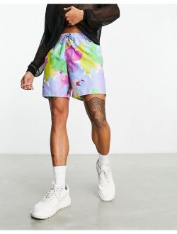 swim shorts in mid length in abstract floral print