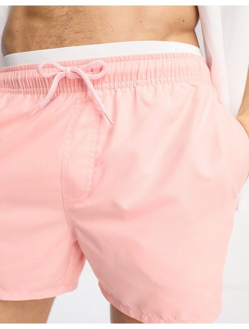 ASOS DESIGN swim shorts in short length with contrast waistband in pink