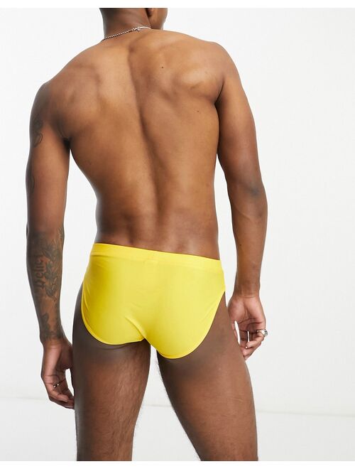 ASOS DESIGN swim briefs in yellow