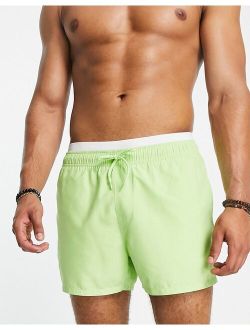 swim shorts in short length with double waistband in lime green