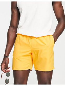 swim shorts in mid length in orange