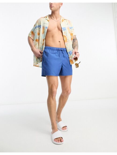 ASOS DESIGN swim shorts in short length in blue