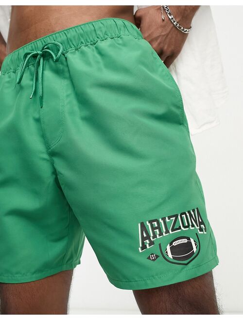 ASOS DESIGN swim shorts in short length with 'Arizona' print in green
