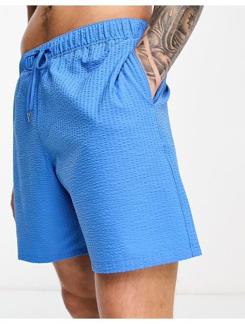 ASOS DESIGN swim shorts in mid length in seersucker blue