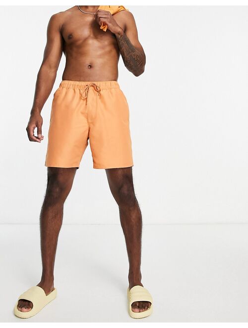 ASOS DESIGN swim shorts in mid length in caramel