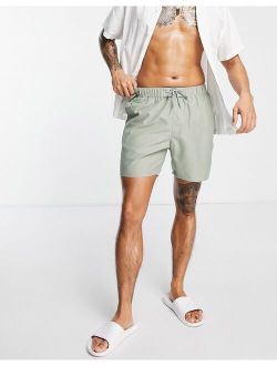 swim shorts in mid length in light khaki