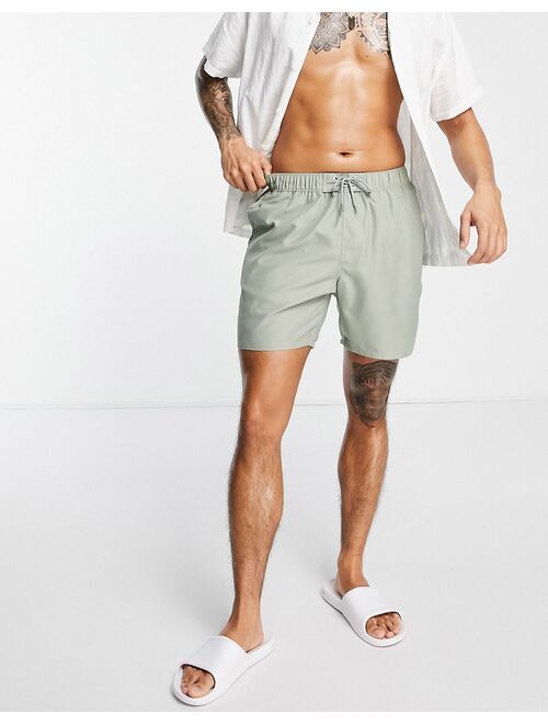ASOS DESIGN swim shorts in mid length in light khaki