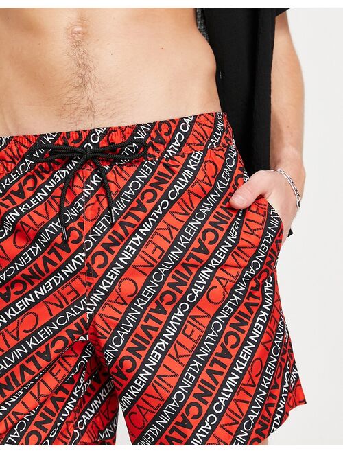 Calvin Klein swim shorts in red logo print
