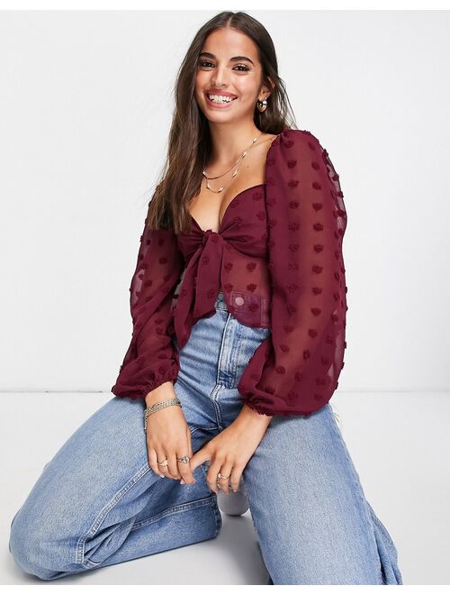 ASOS DESIGN textured sheer volume sleeve blouse with tie front detail in oxblood