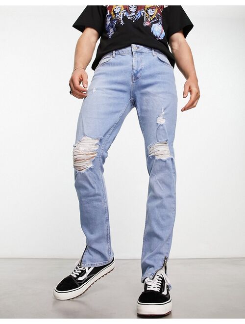 ASOS DESIGN skinny jeans with knee rips and zip detail in light blue