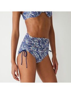 Ruched high-rise bikini bottom with adjustable side ties in purple paisley