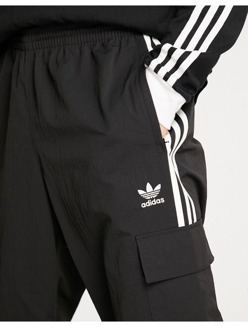 adidas Originals adicolor three stripe cargo sweatpants in black