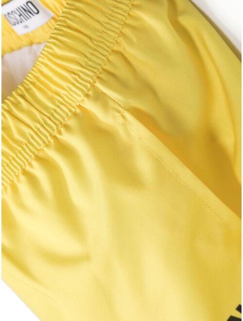 Moschino Kids Smiley logo-print swim shorts