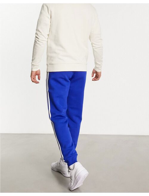 adidas Originals adicolor 3-Stripes sweatpants in blue