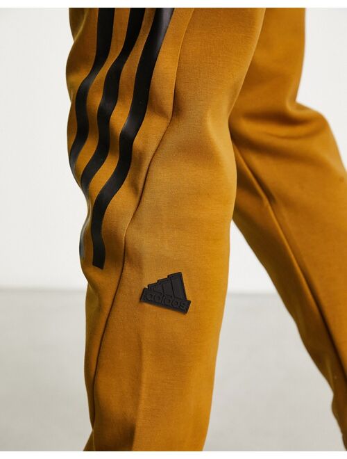 adidas performance adidas Sportswear Future Icons 3 stripes sweatpants in dark orange