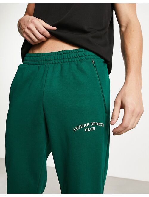 adidas performance adidas Training Sports Club graphic sweatpants in green