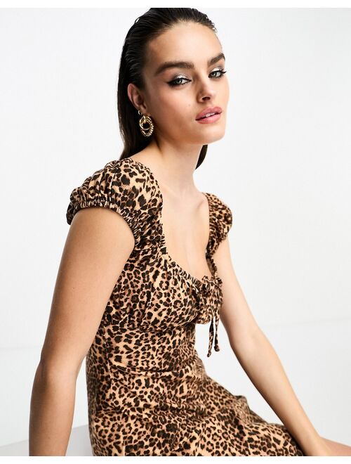 ASOS DESIGN cap sleeve ruched mini dress with tie detail in animal print