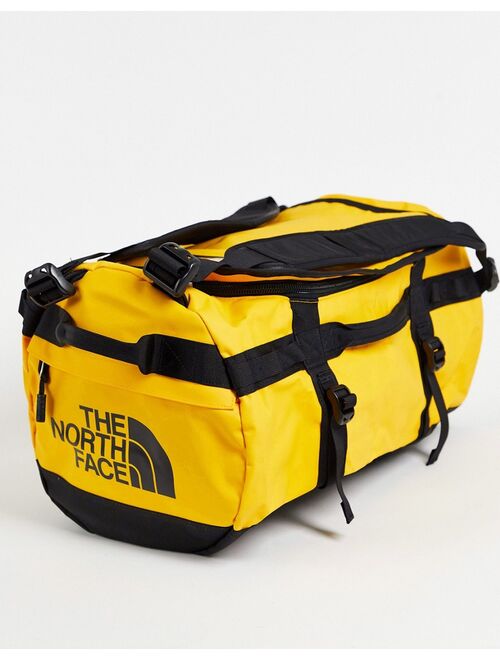 The North Face Base Camp 50l medium duffel bag in yellow and black