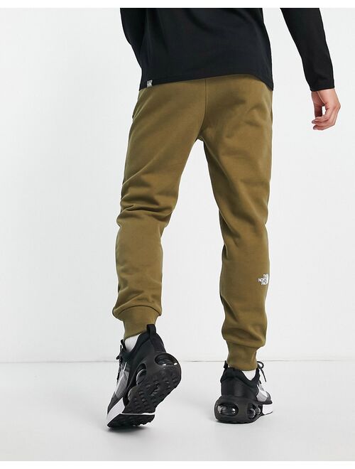 The North Face Graphic joggers in green